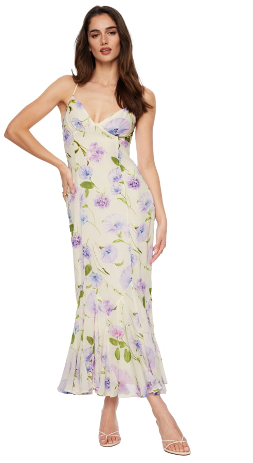 Model is wearing a cream floral maxi dress.