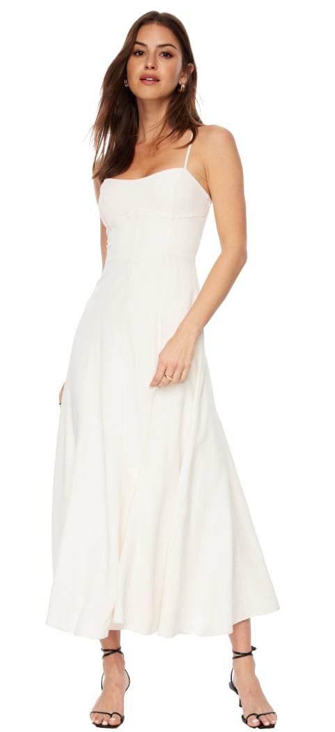 Model is wearing a  white scoop neck maxi dress.