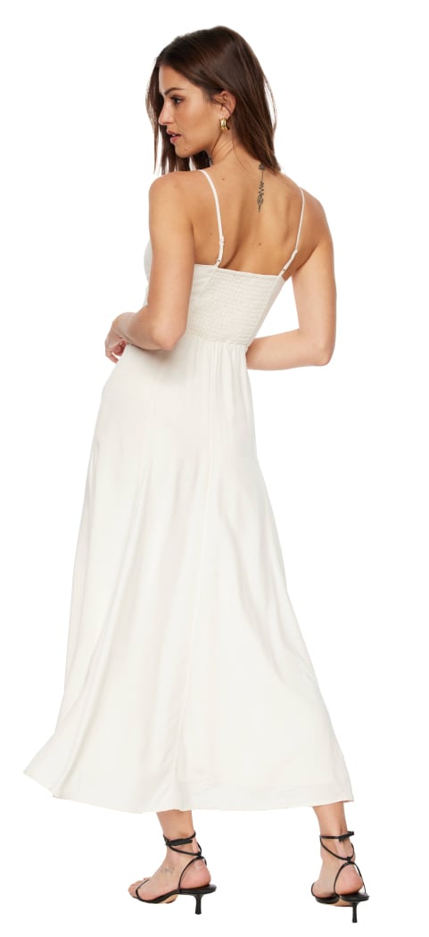 Model is wearing a  white scoop neck maxi dress.